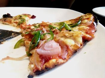 High angle view of pizza served in plate