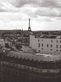 Buildings against cloudy sky