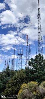 Low angle view of communications tower against sky