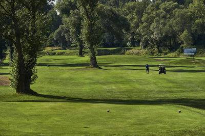 Man playing golf on course