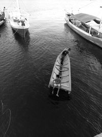 High angle view of man in boat moored at sea