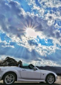 Vintage car against sky on sunny day