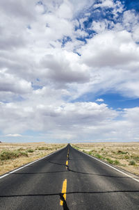 Empty road against sky