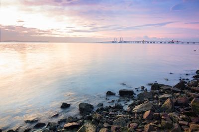 Scenic view of sea against sky at sunset