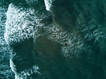 Aerial view of surfer in sea
