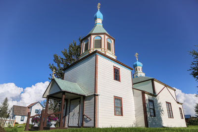 Low angle view of building against blue sky