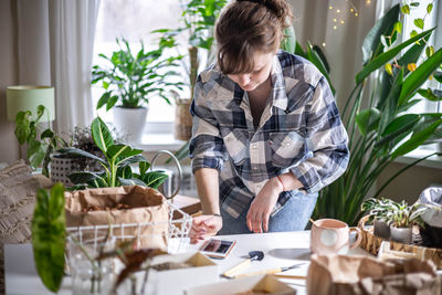 Young woman using laptop at home