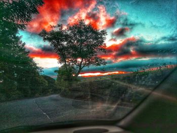 Scenic view of sunset seen through car window