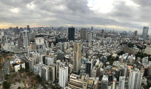 High angle view of modern buildings in city against sky