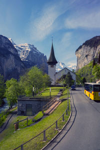 Road by mountain against sky