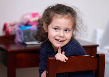 Pretty girl posing for a portrait during a video chat with grandma