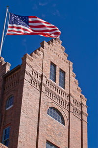 Low angle view of building against blue sky