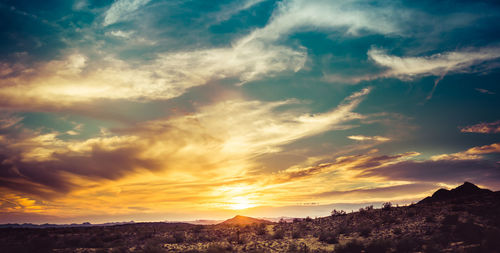 Low angle view of dramatic sky during sunset