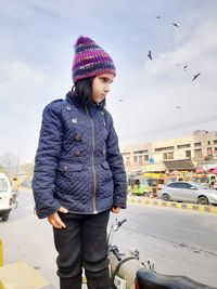 Portrait of man standing on street