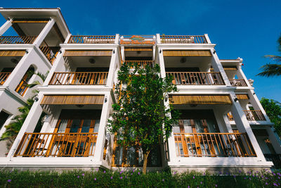 Low angle view of building against clear blue sky