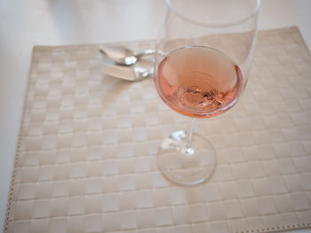 High angle view of wine in glass on table