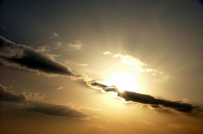 Sun shining through clouds