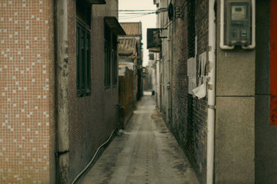 Rear view of woman walking on street