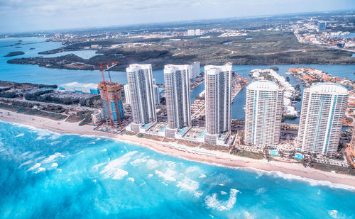 High angle view of swimming pool by buildings in city