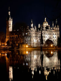 Illuminated buildings in city at night