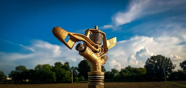 Low angle view of statue against blue sky