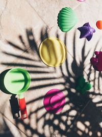 High angle view of colorful toys on footpath