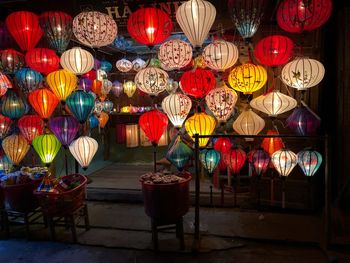 Illuminated lanterns for sale at market during night