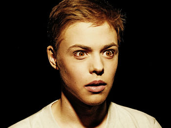 Close-up portrait of a serious young man