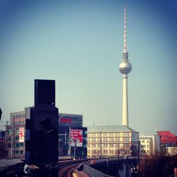 View of communications tower in city