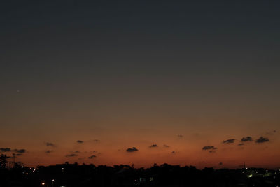 Silhouette trees against sky during sunset