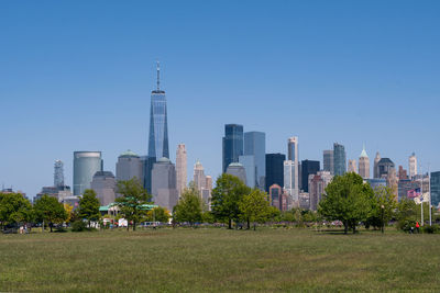 View of buildings in city against clear sky