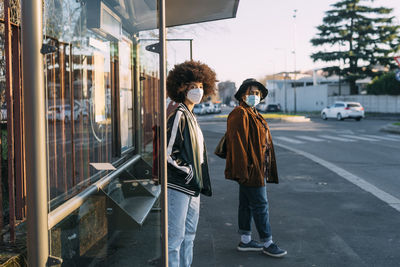 People standing on street in city