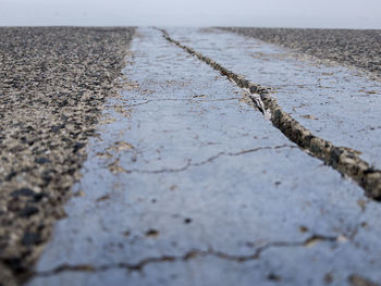 Surface level of footpath by road on beach