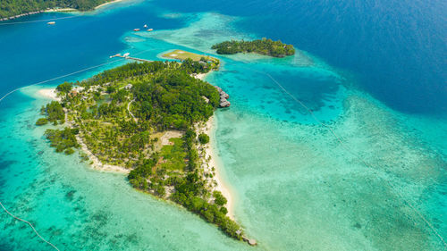 Aerial drone of seascape with beautiful beach and tropical malipano island. philippines, samal.