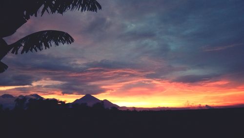 Scenic view of silhouette against sky at sunset