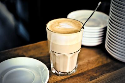 Close-up of latte macchiato on table