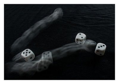 Digital composite image of dice and water