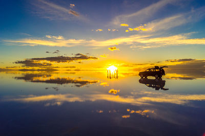 Scenic view of lake against sky during sunset