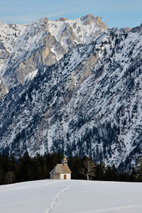 Scenic view of snowcapped mountains against sky