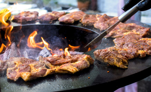 Close-up of meat cooking on barbecue grill