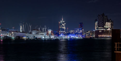 Illuminated city at waterfront