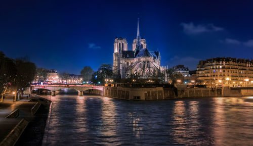 Illuminated buildings in city at night