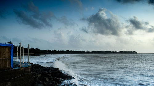 Scenic view of sea against cloudy sky