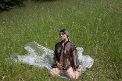 Woman sitting on a field