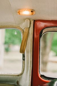 Close-up of vintage car interior with illuminated light bulb