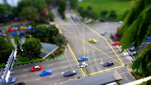 Tilt-shift image of cars on street