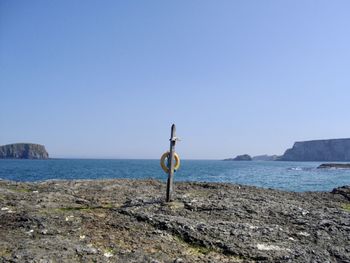 Scenic view of beach against clear sky