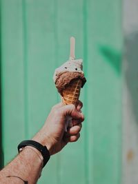 Cropped hand of person holding ice cream