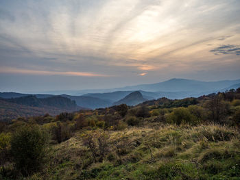 Scenic view of landscape against sky during sunset