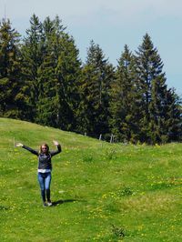 Rear view of man standing on field